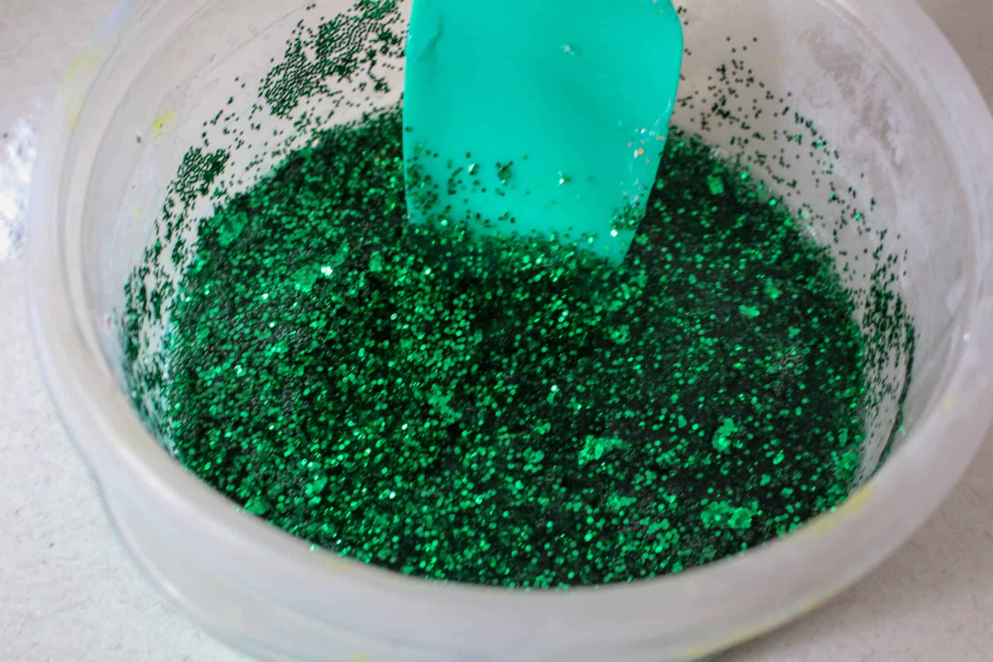 Everyone's favorite christmas movie, turned into a DIY Christmas Slime! This Christmas Grinch Slime is the perfect craft for the Christmas season! #christmas #crafts #slime #christmasslime #christmascrafts #thegrinch