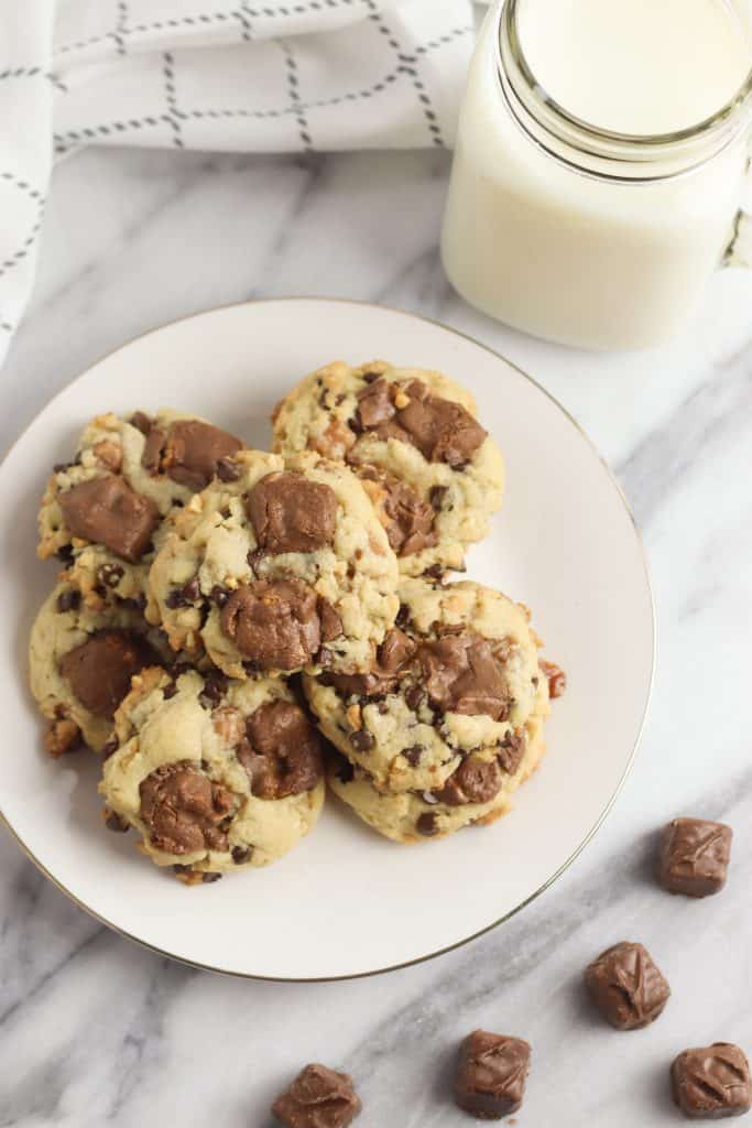Snickers Cookies on white plate with milk