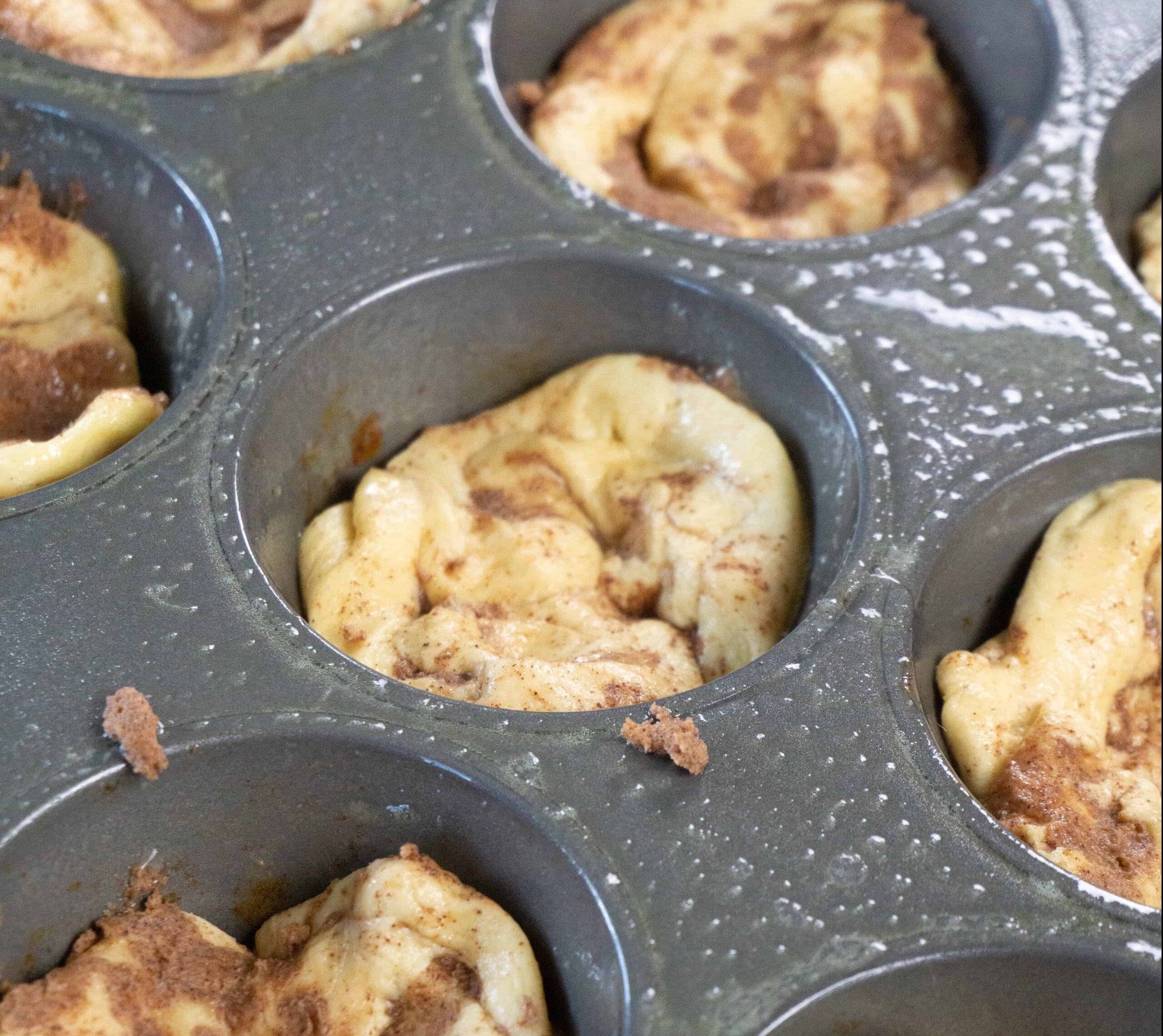 Muffin tin with cinnamon roll dough - apple cinnamon muffins