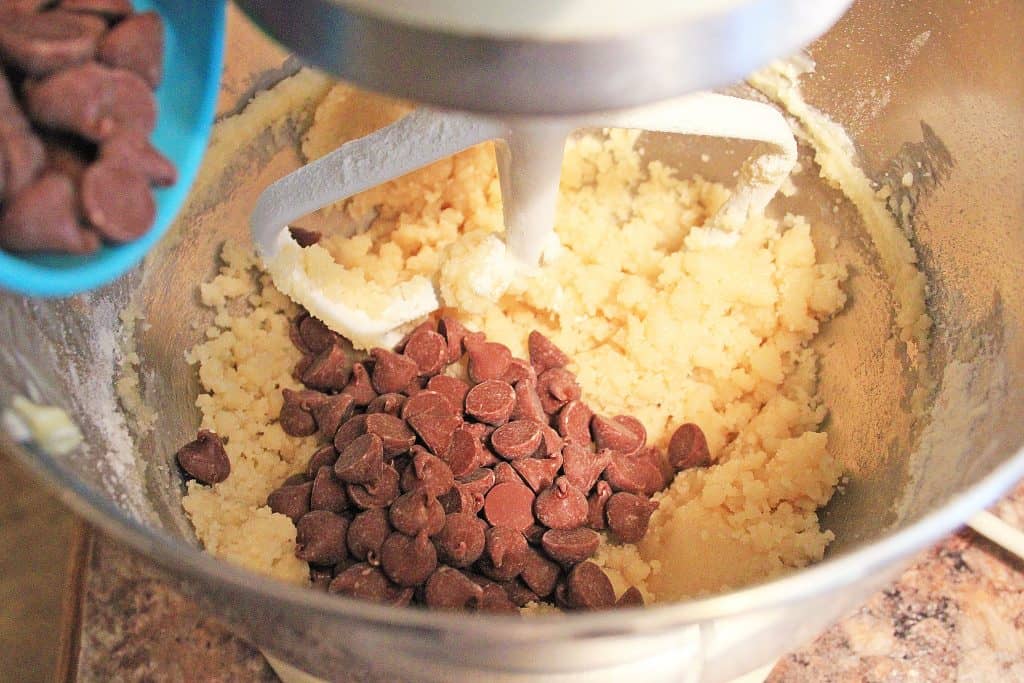 dry ingredients plus chocolate chips in mixing bowl during process of cooking cookie dough fudge