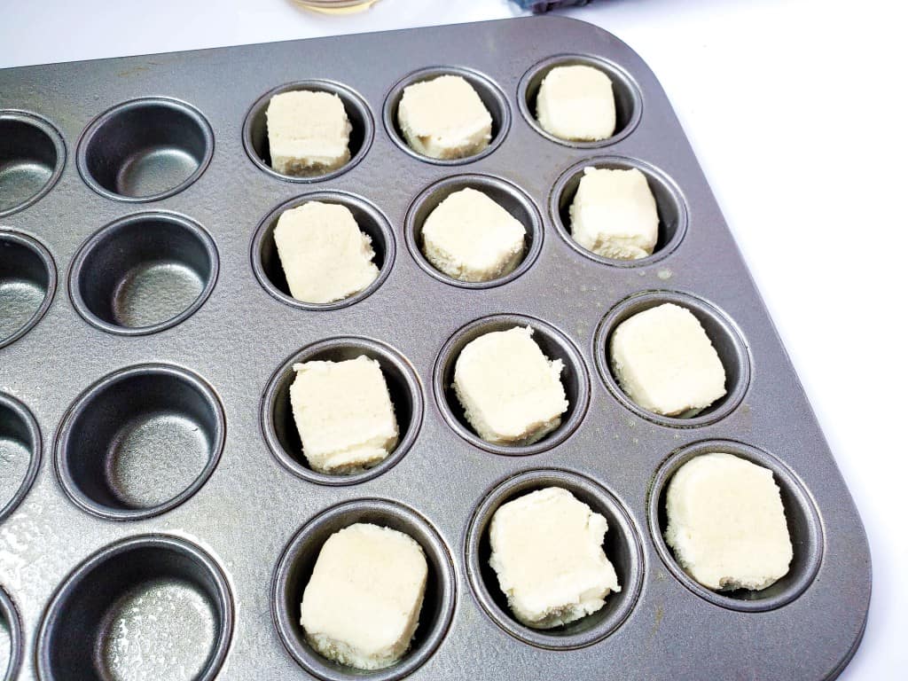 Sugar Cookie Fruit Cups - Crurst being placed in muffin cups
