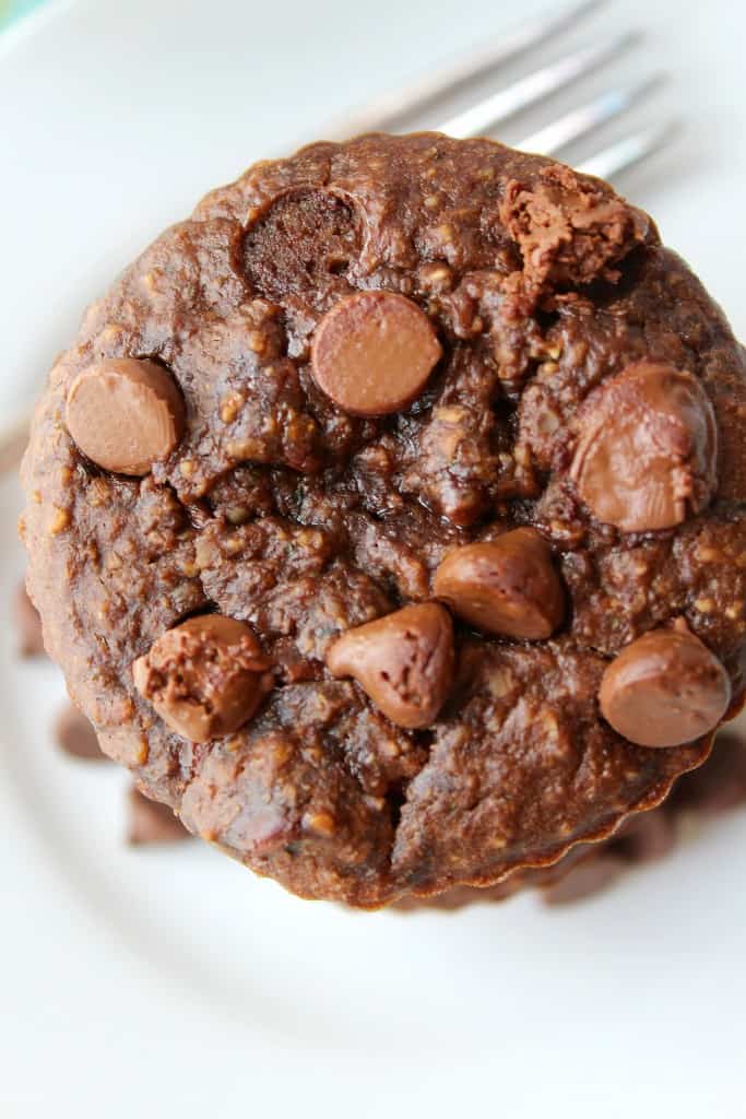 Double Chocolate zucchini muffins are loaded with chocolate chips and plenty of zucchini! Shredded zucchini makes these chocolate muffins moist and crazy delicious. They bake up perfectly and are the best way to use up zucchini. #zucchinirecipes #zucchinimuffins #muffinrecipes #chocolate #desserts