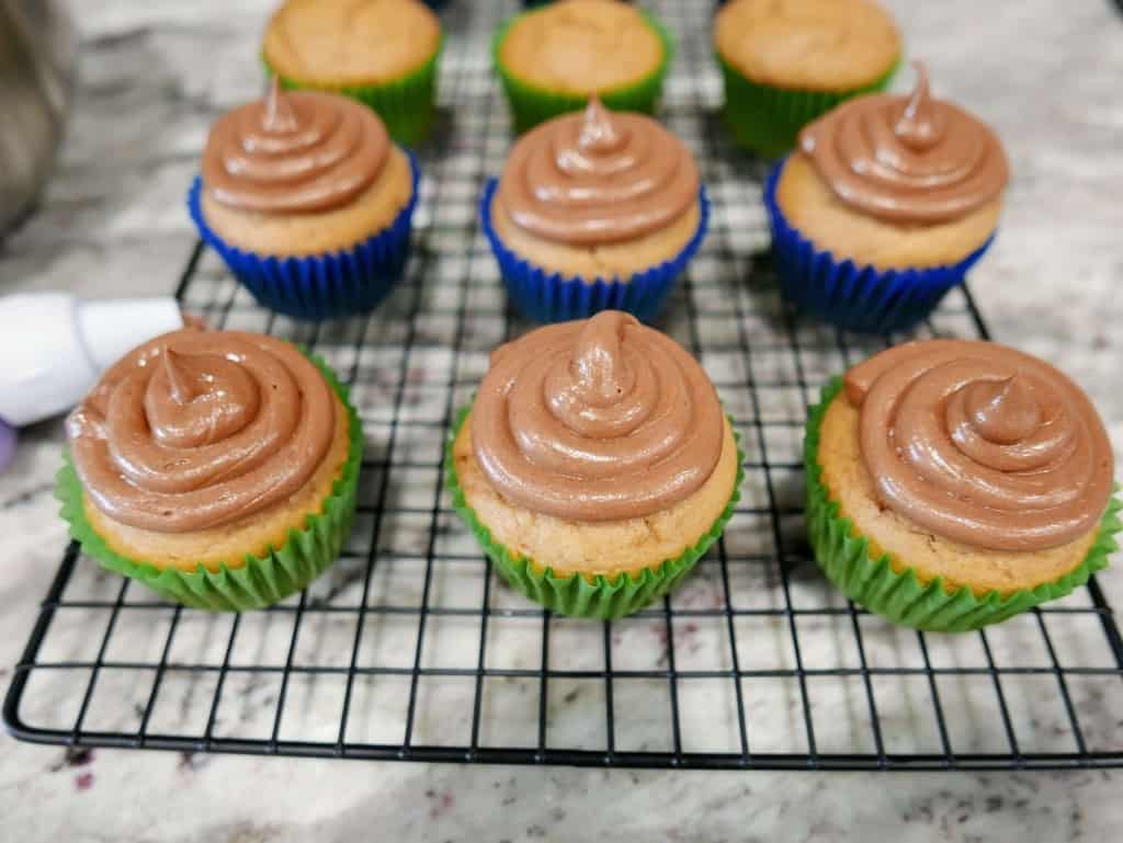 Nutella Cupcakes after being iced on wire cooling rack.