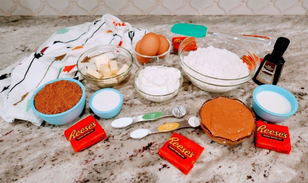 Ingredients to make Nutella Reese's Cupcakes on marble countertop