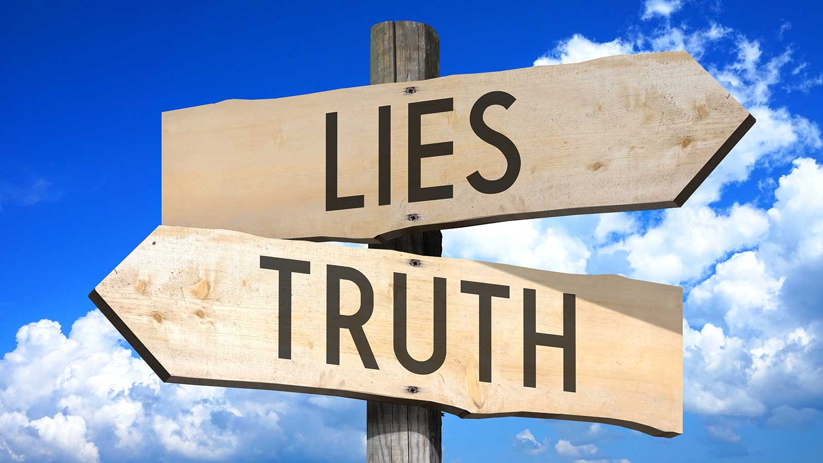 Lies, truth wooden signpost