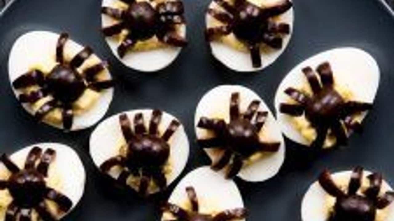 Halloween Deviled Eggs Recipe Topped with Spiders